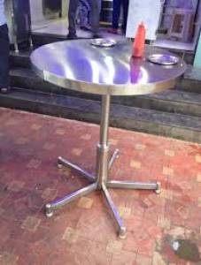 Standing round dining table